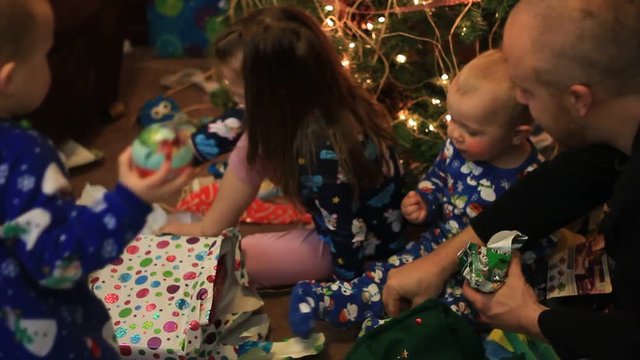 DAD HANDING OUT CHRISTMAS CANDY TO KIDS