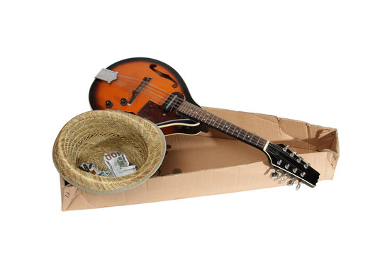 Mandolin and other things of a strolling musician on a white background