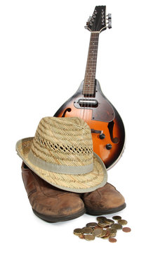 Mandolin and other things of a strolling musician on a white background