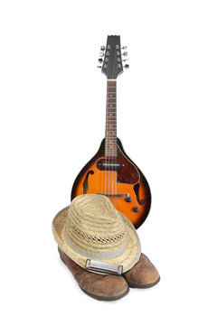 Mandolin and other things of a strolling musician on a white background