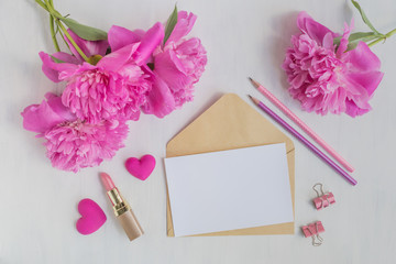 Mockup white greeting card and envelope with pink peonies