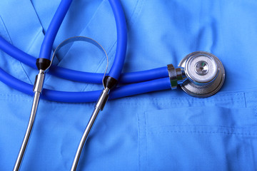 Doctor coat with medical stethoscope on the desk