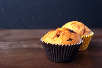 Tasty chocolate cupcakes, muffins on a white wooden table
