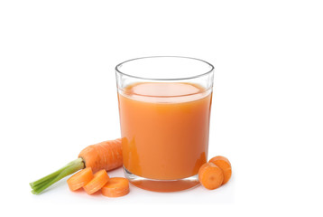 Glass with carrot juice and fresh vegetable on white background