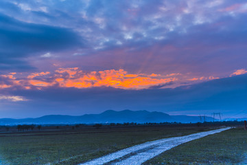 Obraz premium Dramatic clouds at the sunset
