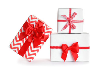 Beautifully wrapped gift boxes on white background