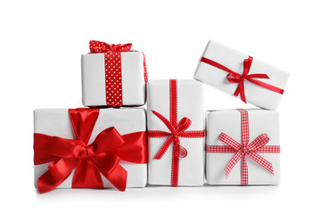 Beautifully wrapped gift boxes on white background