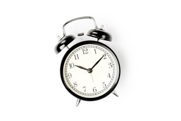 Black alarm clock  on white background.