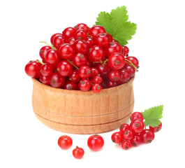 red currant in wooden bowl with green leaf isolated on white background. healthy food