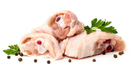 Raw chicken Shin with parsley leaves and black pepper with peas on white background, close-up.