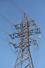 high voltage power line on blue sky
