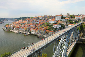 Fototapeta na wymiar View of the historic city of Porto with the Dom Luiz I bridge, Portugal