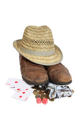 Straw hat and old shoes whit money on a white background