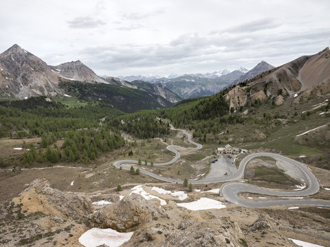panorama from col d'izoard in french alps of haute provence with mountains of parc national des ecrins in the background