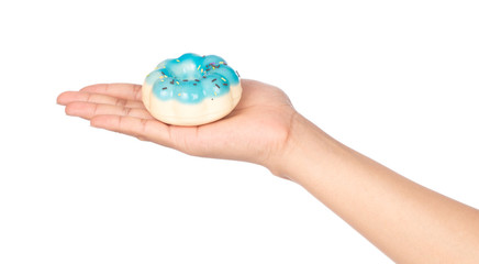 hand holding Donut isolated on white background.