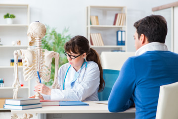 Fototapeta premium Doctor is explaining to patient with neck injury