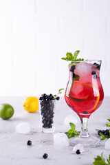 Summer cold drink with blueberry, mint lemon and ice in glass