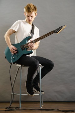 Man playing on electric guitar