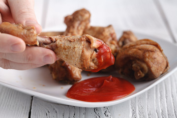 senior man eating fried chicken leg