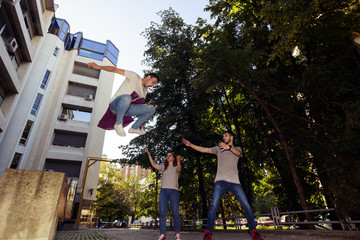 Three Friends Walking Outdoor And Having Fun. Young and careless concept.