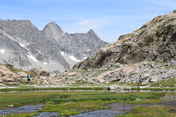small lake with view of the Neouville peak