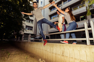 Group of friends having fun in down town. Young and careless concept.