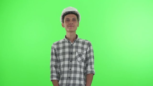 Young architect on a green chroma key