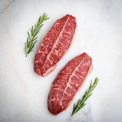 Raw fresh meat Top Blade steaks on light background. top view
