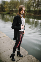 Outdoors portrait of beautiful young brunette girl.