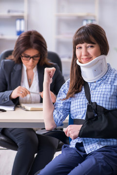 Injured employee visiting lawyer for advice on insurance