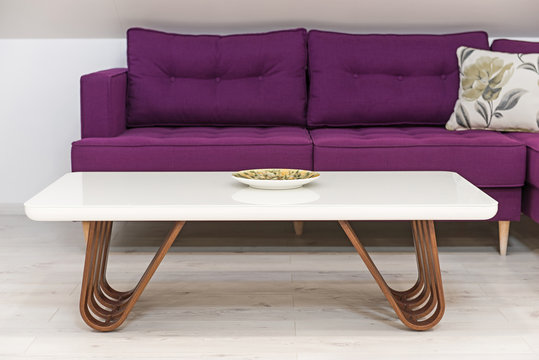 Living room interior, loft apartment, attic renovation, purple furniture