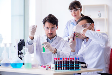 Team of chemists working in the lab