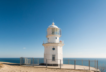 Fototapeta na wymiar Lighthouse, Cape Meganom. City district Sudak, the Republic of Crimea.