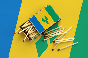 Saint Vincent and the Grenadines flag  is shown on an open matchbox, from which several matches...