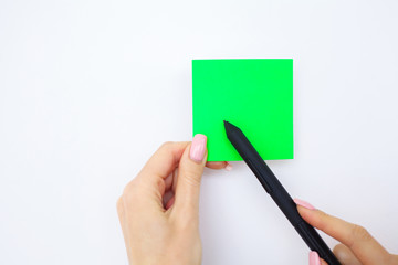 Blank Folder with Green Paper. Hand that Holding Folder and Pan Handle on White Background. Copyspace. Place for Text