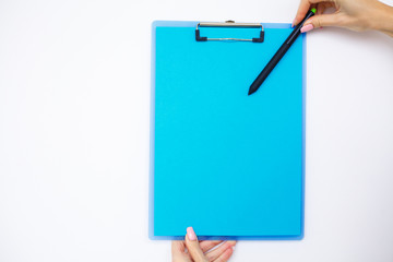 Blank Folder with Blue Paper. Hand that Holding Folder and Pen on White Background. Copyspace. Place for Text.