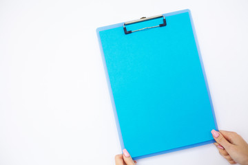 Blank Folder with Blue Paper. Hand that Holding Folder and Pen on White Background. Copyspace. Place for Text.