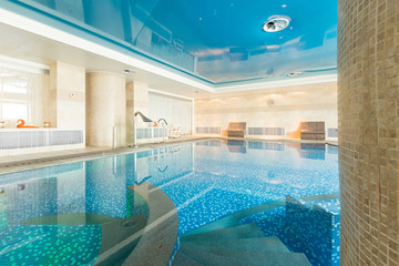 Indoor swimming pool in hotel spa center