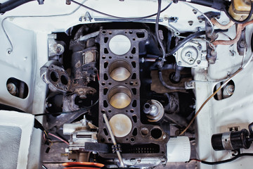 Engine valve car maintenance.The cylinder block of the four-cylinder engine. Disassembled motor...