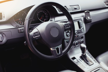 Modern luxury car Interior - steering wheel, shift lever and dashboard. Car interior luxury inside....