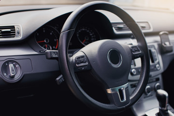 Modern luxury car Interior - steering wheel, shift lever and dashboard. Car interior luxury inside....
