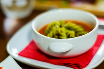 tasty and nutritious tomato soup with fresh pasta, dietary meal