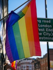 Gay pride rainbow stripes flag hanging in London 