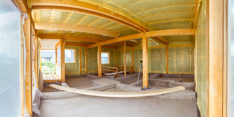 Panorama Building a house. Warming of the walls of the house. Steam insulation of walls. The building site of the cottage. Construction of a cottage.