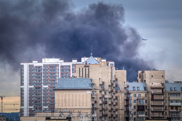 Fire. Black smoke over the building. City fire. Smoke from a fire.