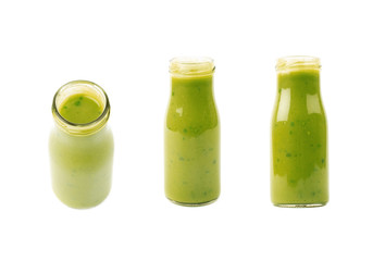 Green sauce in a bottle isolated
