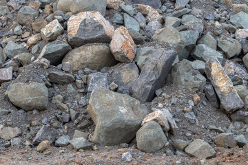 Background of large granite piles.