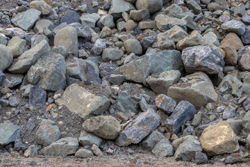 Background of large granite piles.