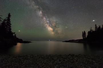 Mars and The Milky Way reflecting in a cove in Acadia National Park © Michael