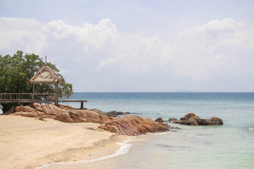 View of the pavilion and footbridge with blue sea